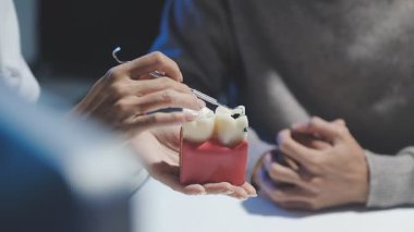 dentist and patient in dental clinic, close up