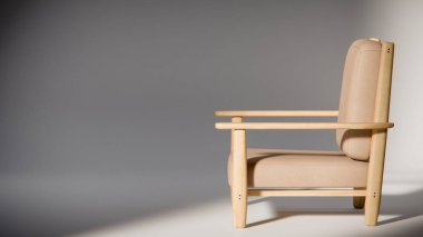 Minimalist ışıklandırmada bej yastıklı modern ahşap koltuk. Mobilya tasarımı, ürün gösterimi ve iç görselleştirme için ideal üç boyutlu tasarım ve mimari modelleme.