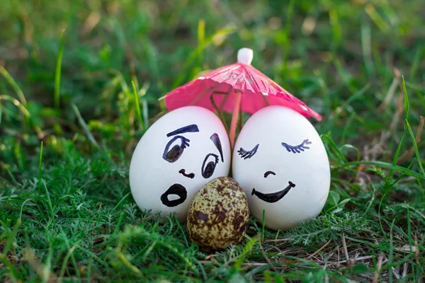 Funny eggs imitating white mother and father with versicolored b — Stock Photo, Image