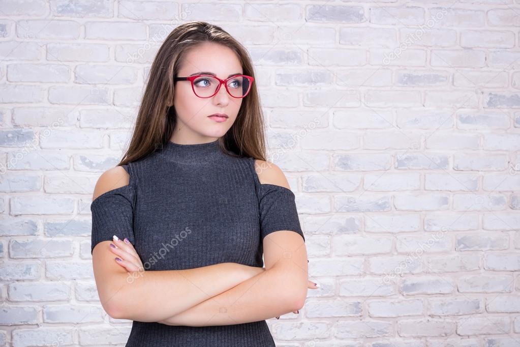 Business look of young woman with red eyeglasses