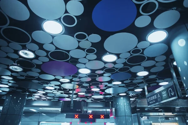 unusual design ceiling in the Beijing subway from oval light sources. Beijing