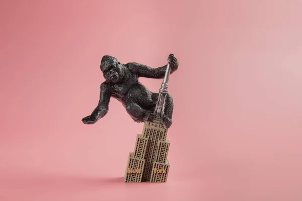 King Kong souvenir on the Empire State Building, on pink background