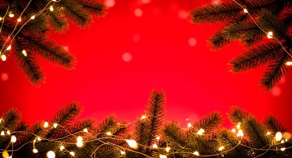 Kırmızı arkaplanda noel ağacı dalı.