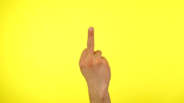 Fuck you sign by male hand isolated on yellow. Middle finger Sign — Stok Video