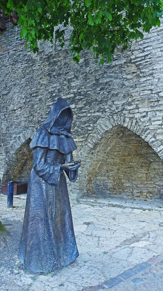 Metal statue of monk in Tallinn