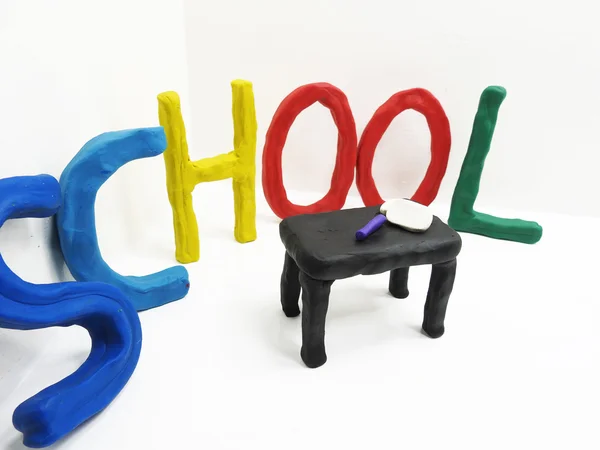 The word school made from plasticine. — Stock Photo, Image