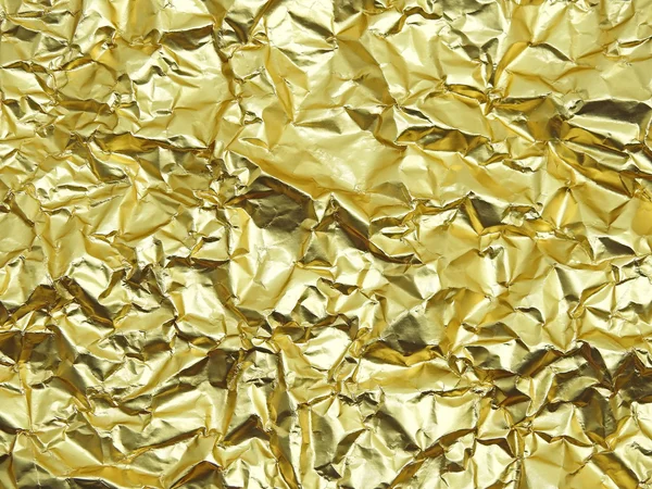 Monotone texture of the golden foil. — Stock Photo, Image