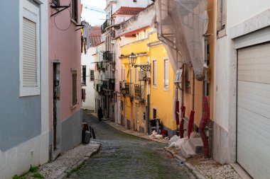 A charming, colorful cobblestone alleyway in an old European city