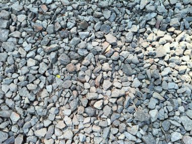 Gri ve kahverengi ezilmiş kaya, çakıl ya da safranın tam çerçeve dokusu