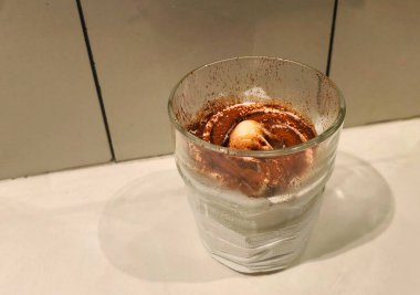 Creamy Dessert with Cocoa Powder Topping in Glass