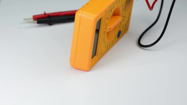 Yellow Digital Multimeter Rotating White Plate — Stock Video