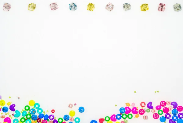 Background with fake jewels and colorful plastic gadgets — Stock Photo, Image