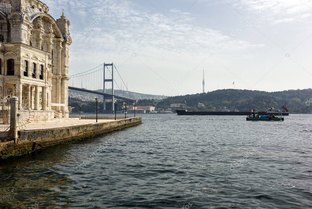 View of the Ottoman Neo-Baroque style Ortakoy Mosque and Bosphorus Bridge on the Bosphorus, as seen from the Ortakoy pier square. Besiktas district, city of Istanbul, Turkey.