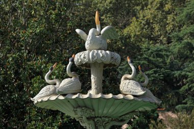 ISTANBUL, TURKEY - OCTOBER 06, 2020. Dolmabahce Palace on the Bosphorus. View of the beautiful sculptural fountain in Selamlik garden. Besiktas district, city of Istanbul, Turkey. clipart