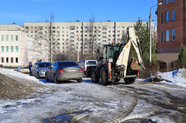 BALASHIKHA, RUSSIA - MARCH 19, 2021. Residential area on the spring sunny day. Road covered with melted snow and ice. City of Balashikha, Moscow region, Russia.