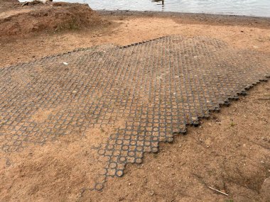 Interlocking Circle Paver Ground Cover Tiles Over Dirt Surface