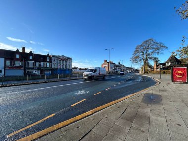 Hull, East Yorkshire, UK, November 13th Anlaby Rd, Sunny City Street With Vehicles, Shops, And A Tree-Lined Sidewalk