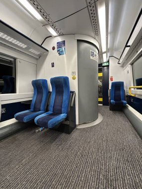 Interior of Modern Train Carriage With Blue Seats
