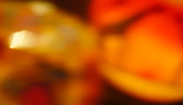 Turuncu kırmızı mumlar için içme gözlük bulanık odaklanmamış parça boyalı