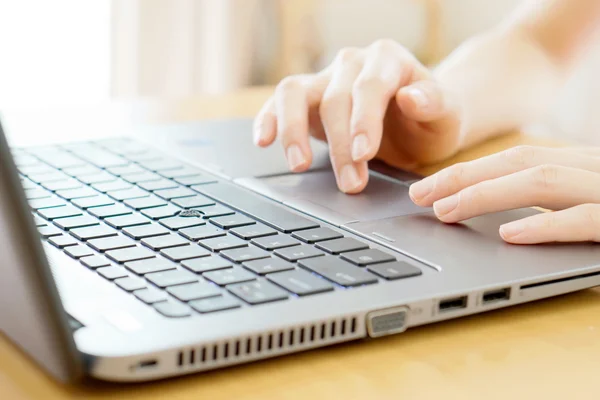 Woman working at home office hand on keyboard close up Stock Photo