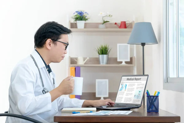 Medical report with patient data and health care information in laptop. Doctor using digital smart device to read report online. Modern technology