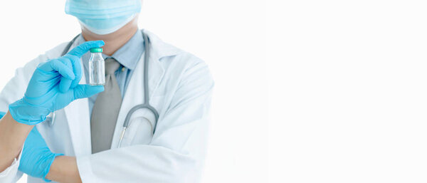 Close up vaccines fight against virus, doctor or scientist in laboratory holding a syringe with liquid vaccines. Concept : diseases,medical care. 