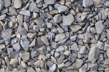 Açısal kaya veya ezilmiş taş kümelenmesinin yüksek kaliteli yakın çekim dokusu, yollar, beton ve peyzaj için yaygın olarak kullanılan temel ve çok yönlü bir yapı malzemesi.