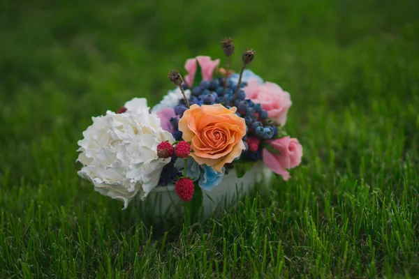 Composition of different flowers in a pot — Stock Photo, Image