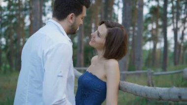 Young family walking in the evening on their farm lands.