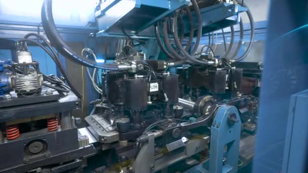 Automatic punching line. The powerful machine punches holes in the steel sheet. — Stock Video