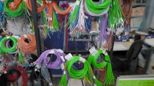 Colored wires in a workshop for the production of car wiring. Different electrical circuits are assembled from different wires — Stock Video