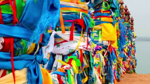 Serge. Sacred poles with colored ribbons in island Olkhon. Burkhan, Lake Baikal — Stock Video