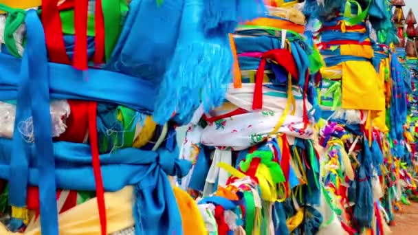 Serge. Sacred poles with colored ribbons in island Olkhon. Burkhan, Lake Baikal — Stock Video
