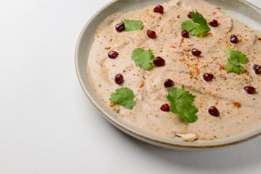Chicken liver pate serveed on a plarwe over white background. Delicious idea for breakfast, pate with bread.