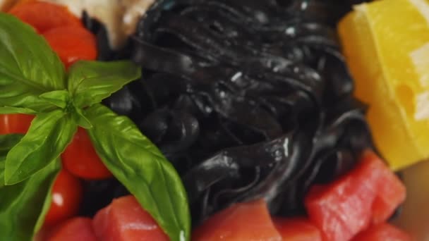 Black Cuttlefish Ink Pasta Salmon Fish Lemon Basil White Plate — Stock Video