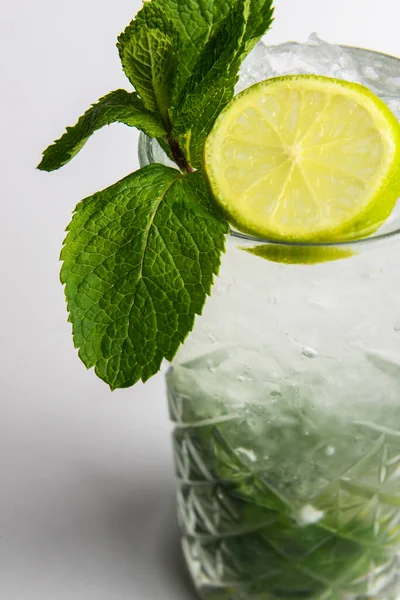 Classic mojito isolated on white background. Summer menu, cold refreshing beverage for hot weather. Close up.