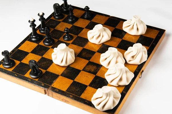 Concept Georgian Cuisine Black Chess Pieces White Khinkali Stand Chessboard — Stock Photo, Image