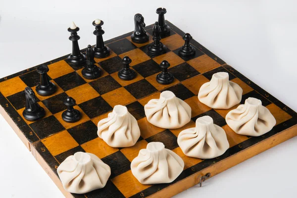 Concept Georgian Cuisine Black Chess Pieces White Khinkali Stand Chessboard — Stock Photo, Image