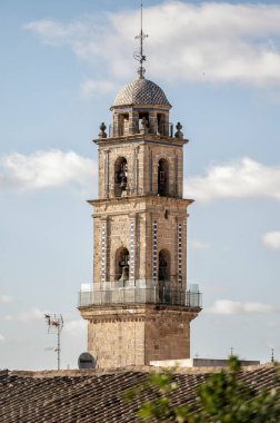 Jerez de la Frontera, Cadiz, Spain; 06-11-2025: Bell tower of San Miguel Church in Jerez de la Frontera, Cadiz, Spain, under a bright blue sky on a sunny day