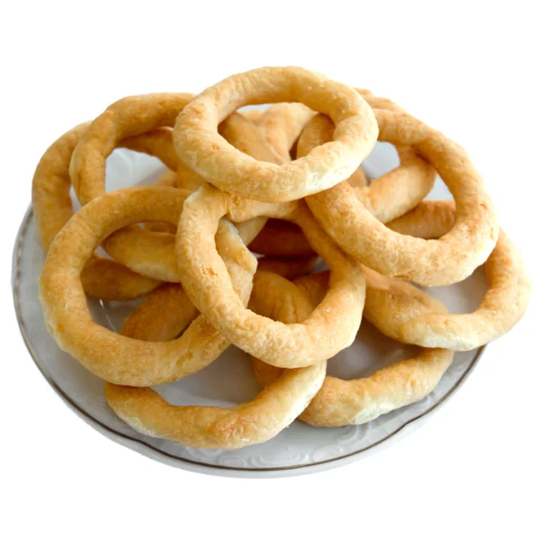 Galletas pretzels sobre un fondo blanco —  Fotos de Stock