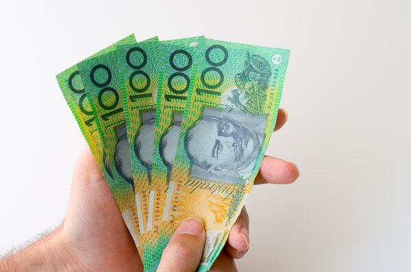 Man holding five hundred Australian Dollar banknote in his hands