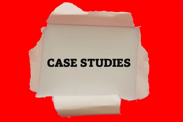 Case Studies words written under torn paper — Stock Photo, Image