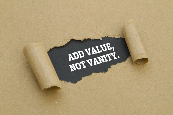 add value, not vanity inscription inside of hole in cardboard