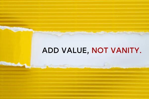 add value, not vanity inscription inside of hole in cardboard