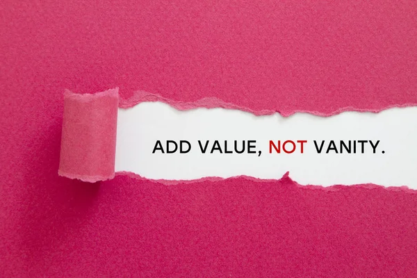 ADD VALUE, NOT VANITY message written under torn paper. — Stock Photo, Image