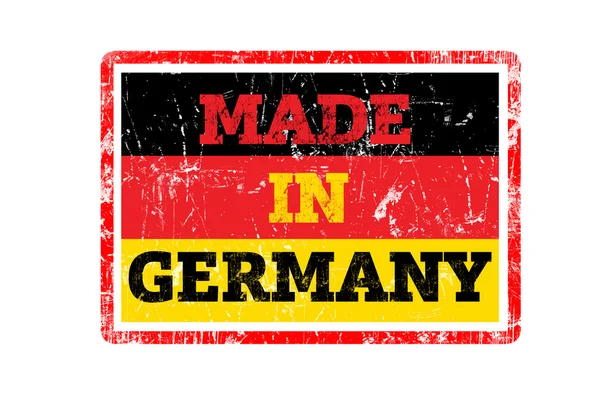 Made In Germany λέξη γραμμένο σε κόκκινο καουτσούκ σφραγίδα και σημαία με άκρες grunge. — Φωτογραφία Αρχείου