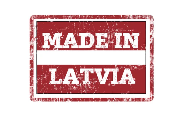 取得在拉脱维亚字写在红色的橡皮戳和旗 grunge 边缘. — 图库照片