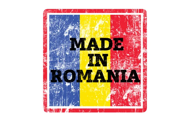 Γίνεται στη Ρουμανία λέξη γραμμένο σε κόκκινο καουτσούκ σφραγίδα και σημαία με άκρες grunge. — Φωτογραφία Αρχείου