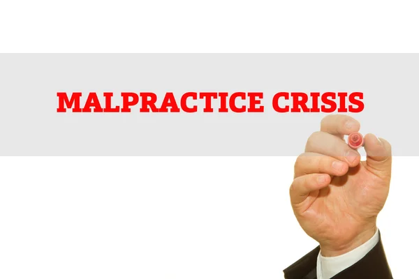Businessman hand writing Malpractice Crisis isolated on white. — Stock Photo, Image