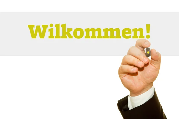 Escribir a mano Wilkommen! sobre una toallita transparente. Mensaje de bienvenida en alemán . — Foto de Stock